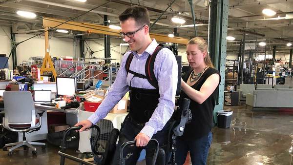 Prof. Patrick Wensing being fit into an Exoskeleton