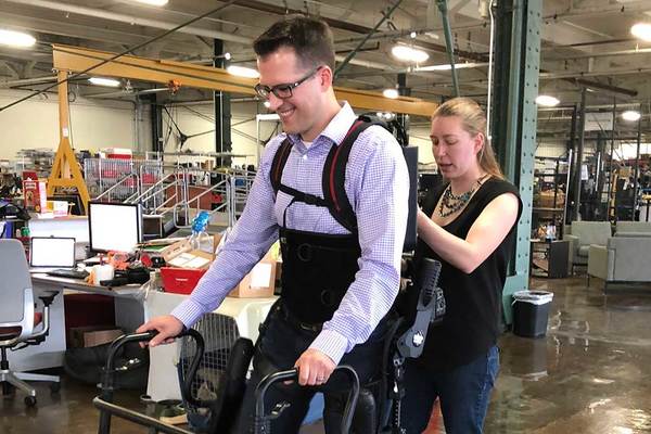 Prof. Patrick Wensing being fit into an Exoskeleton