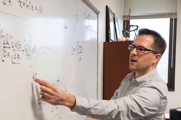 Patrick Wensing at a whiteboard